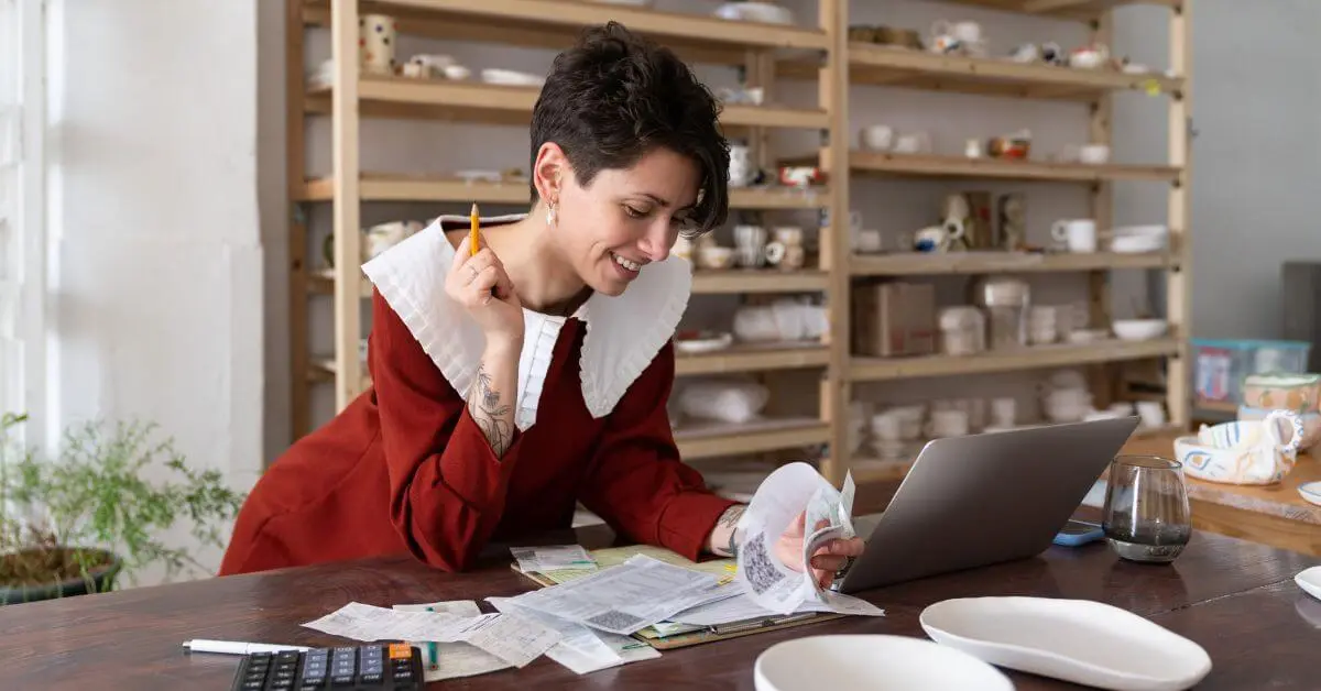 A woman looks over financial reports