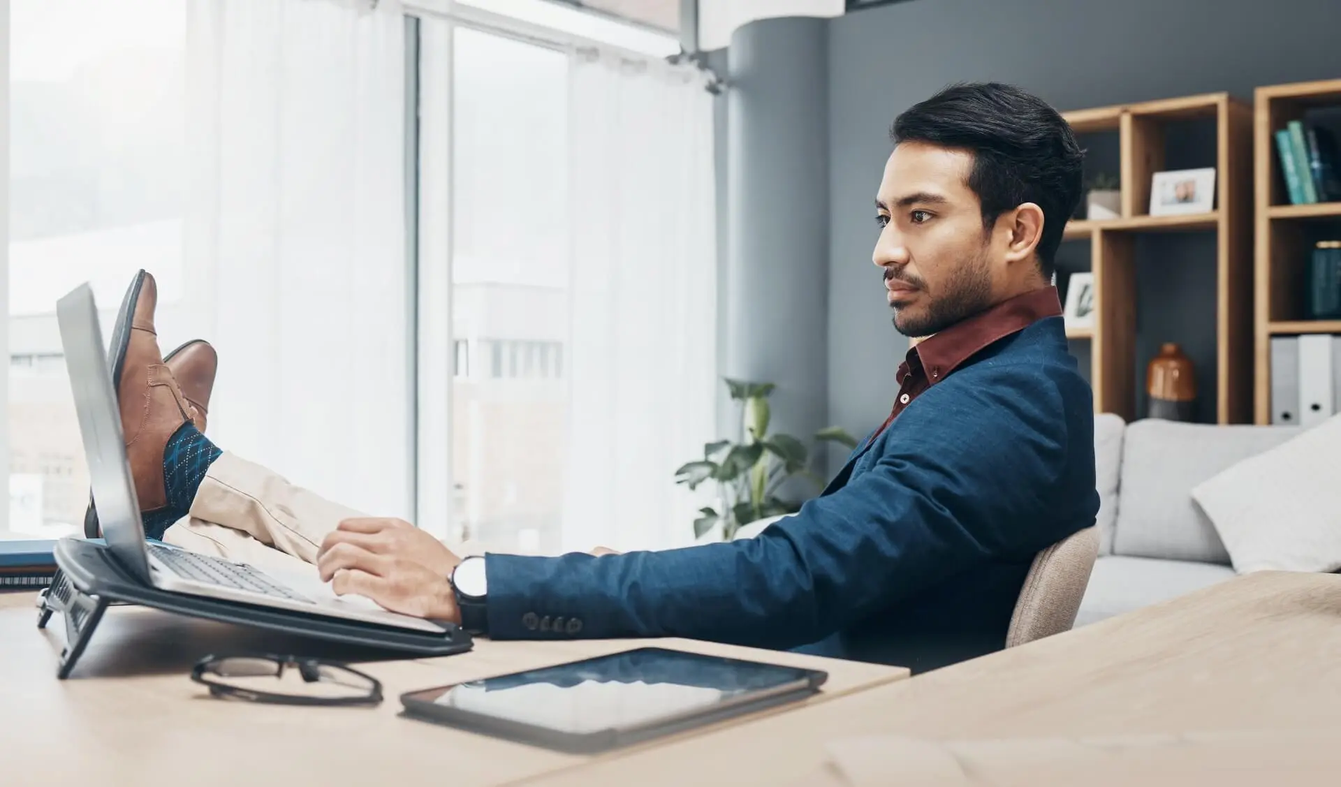 A business owner in 2023 learning how a business can save money in taxes using tax planning.